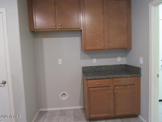 17164 West Straight Arrow Lane Surprise, AZ 85387 - Photo 27 of 39 a kitchen with granite countertop cabinets and utility room