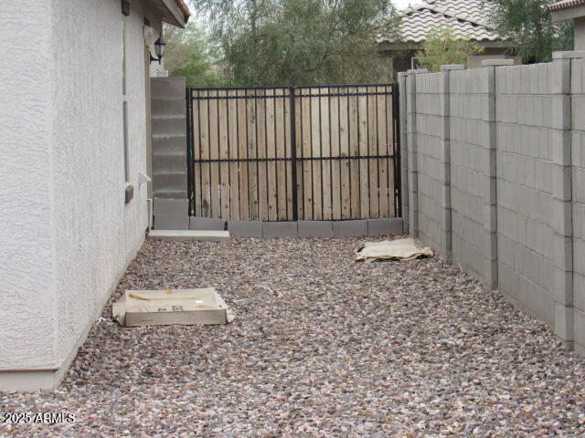 17164 West Straight Arrow Lane Surprise, AZ 85387 - Photo 30 of 39 a view of a backyard of the house