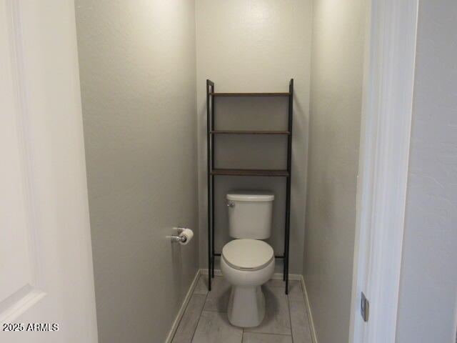 17164 West Straight Arrow Lane Surprise, AZ 85387 - Photo 34 of 39 a white toilet sitting next to a white sink