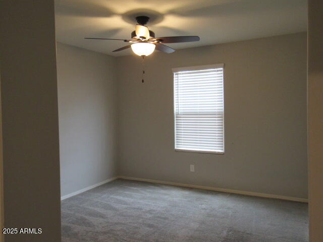 17164 West Straight Arrow Lane Surprise, AZ 85387 - Photo 10 of 39 an empty room with a window