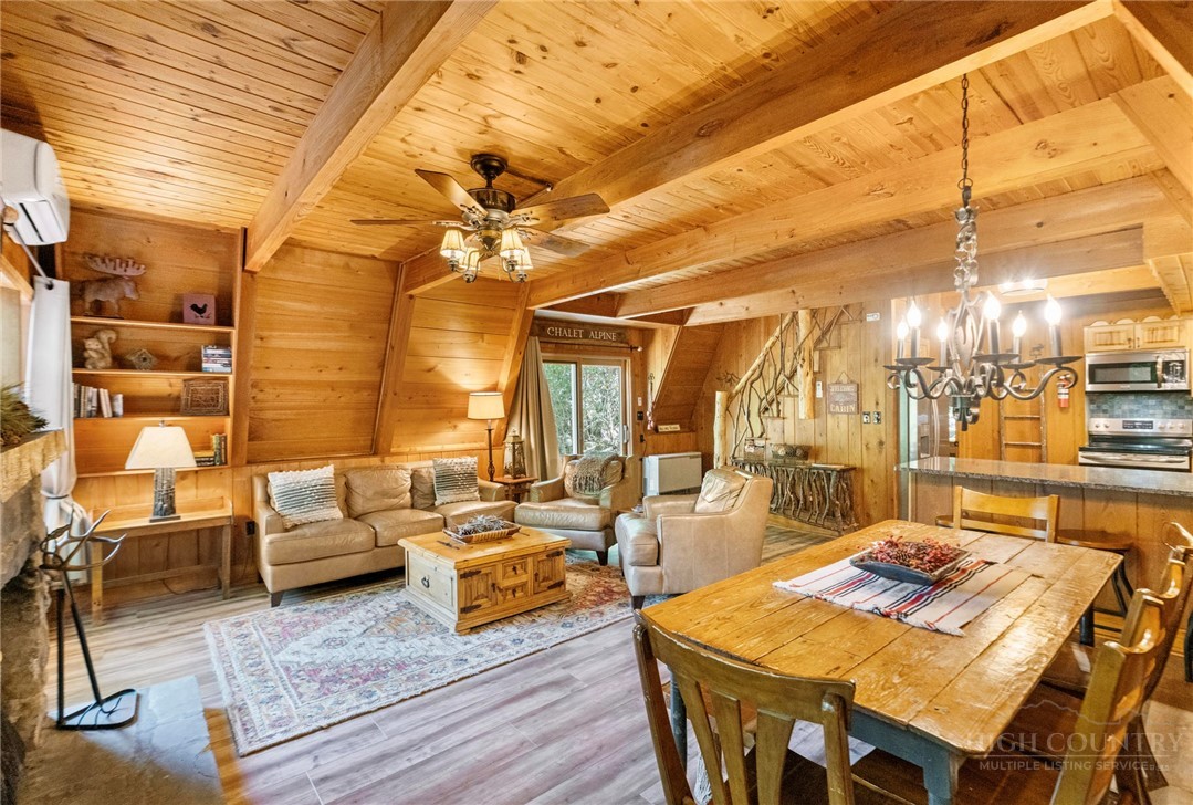 268 Cherry Drive Boone, NC 28607 - Photo 2 of 29 a living room with lots of furniture and a chandelier