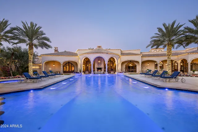 a bedroom with a bed and a night stand