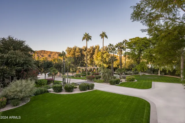 a view of a swimming pool with outdoor seating