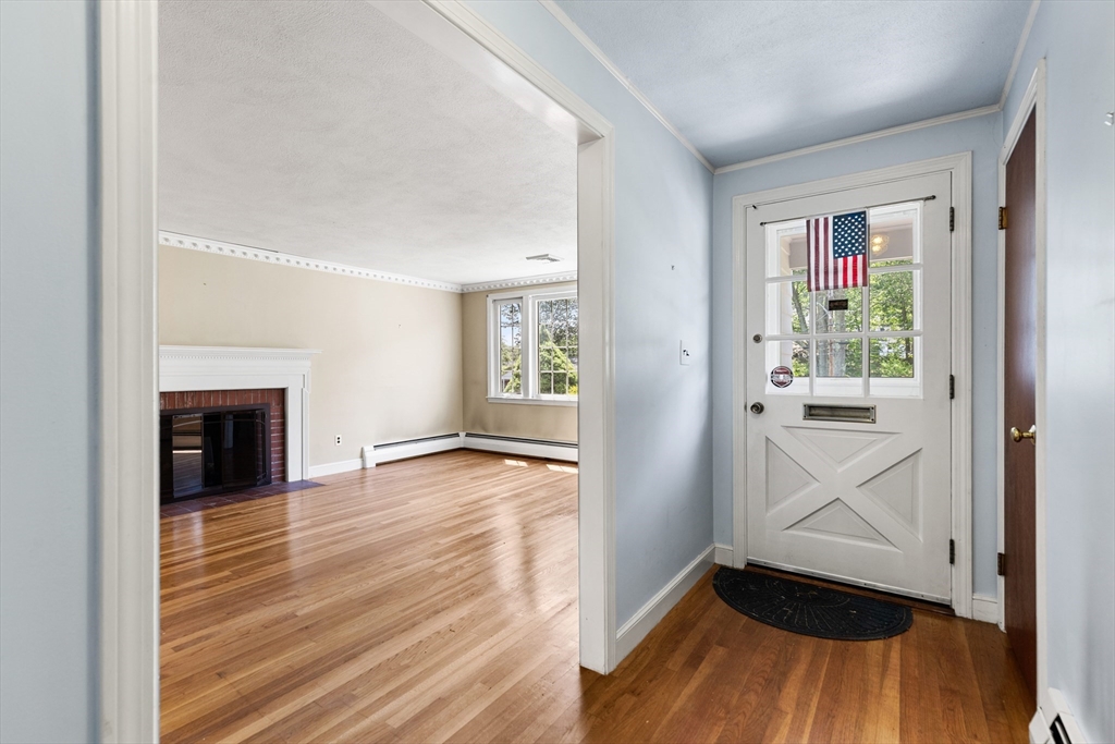 29 Gregory Road Wakefield, MA 01880 - Photo 9 of 29 wooden floor in an empty room with a window