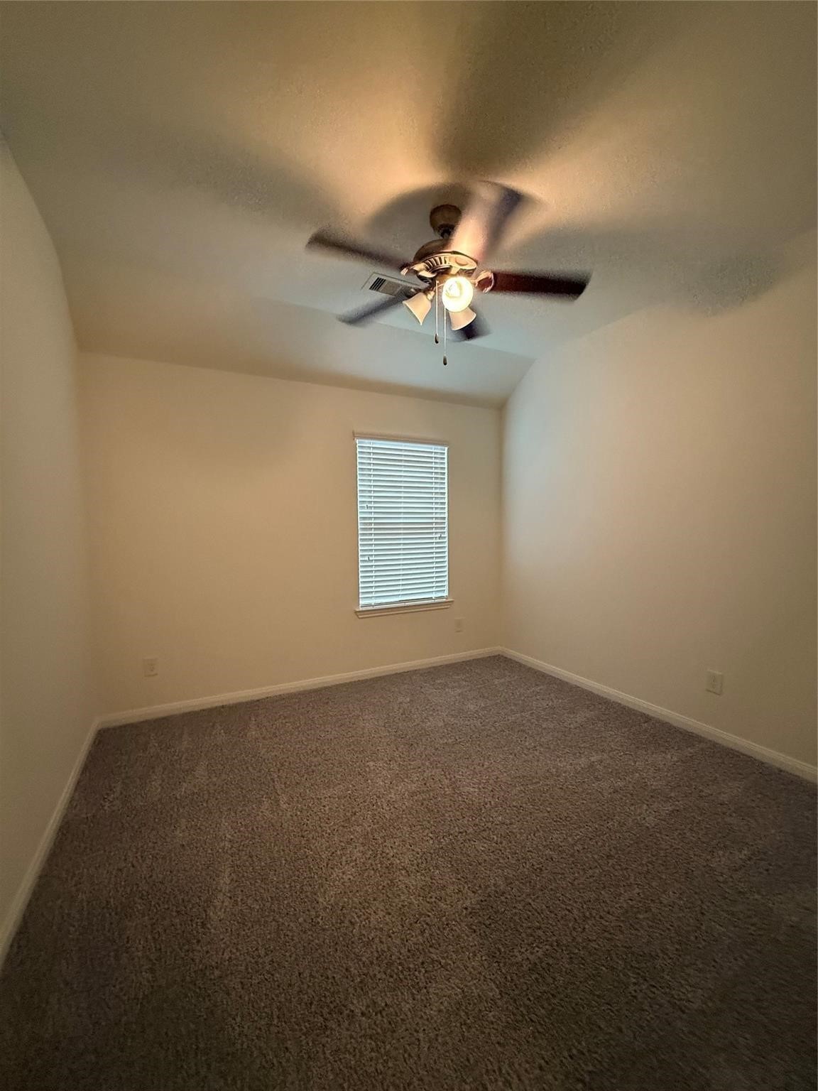 22646 Triangle Ridge Drive Porter, TX 77365 - Photo 12 of 17 an empty room with a window and a fan