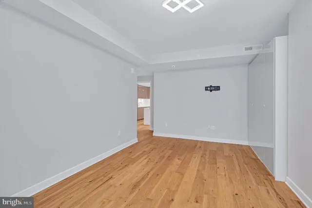 a view of room with wooden floor