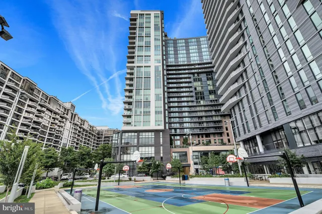 a living room with furniture and large windows