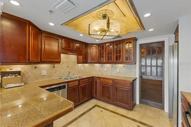 a kitchen with a sink and cabinets