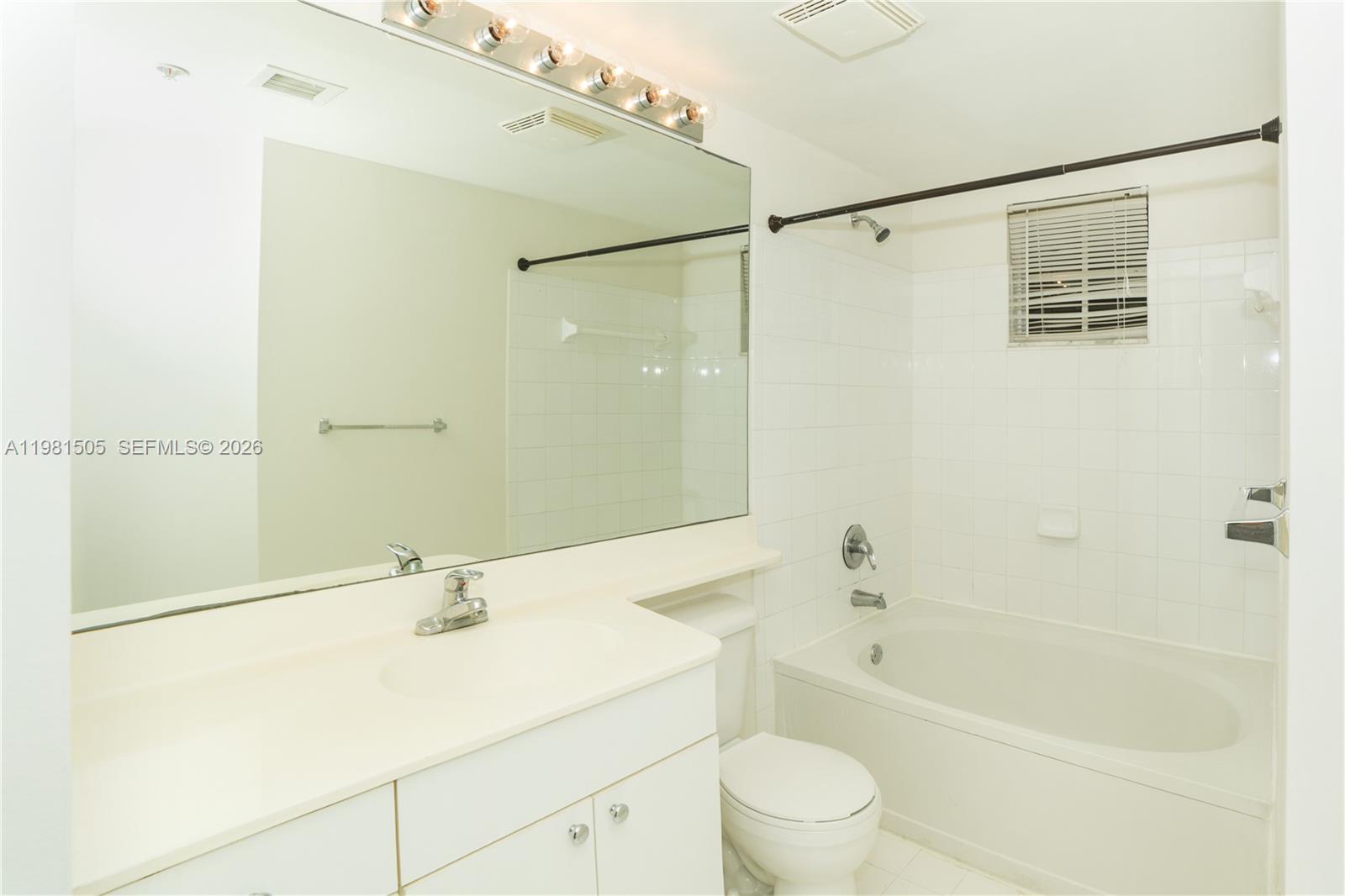 17145 North Bay Road, Unit 4203 Sunny Isles Beach, FL 33160 - Photo 12 of 50 a bathroom with a sink a toilet and shower