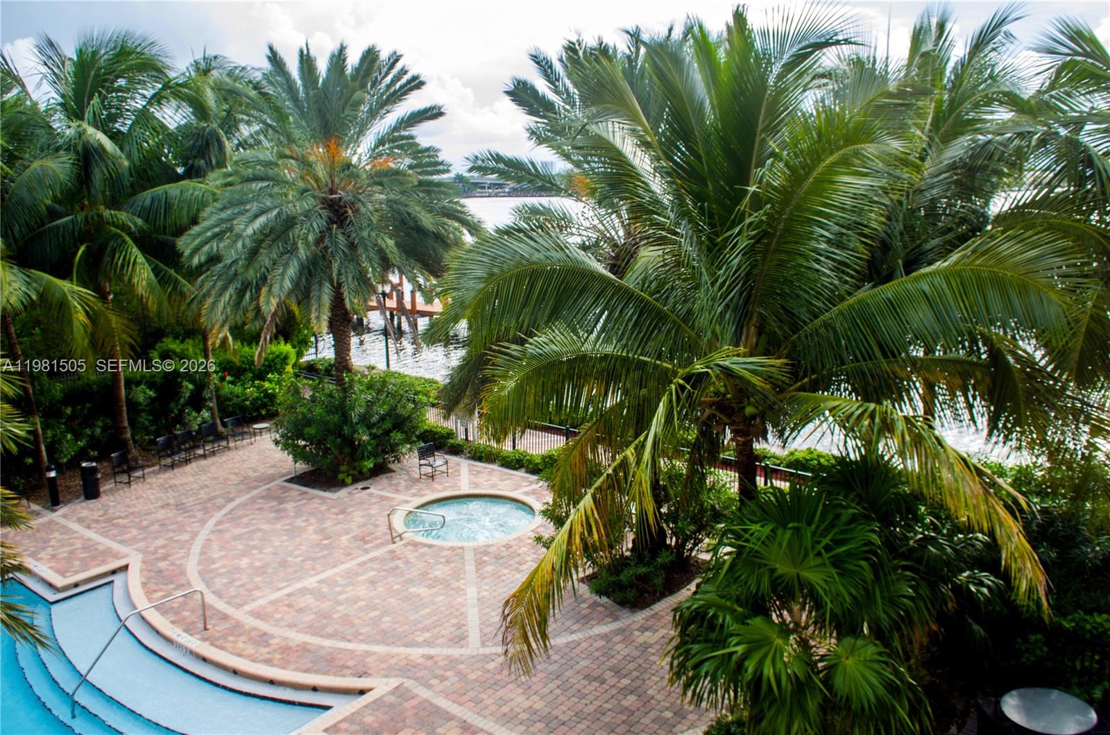 17145 North Bay Road, Unit 4203 Sunny Isles Beach, FL 33160 - Photo 27 of 50 a view of a swimming pool with a garden