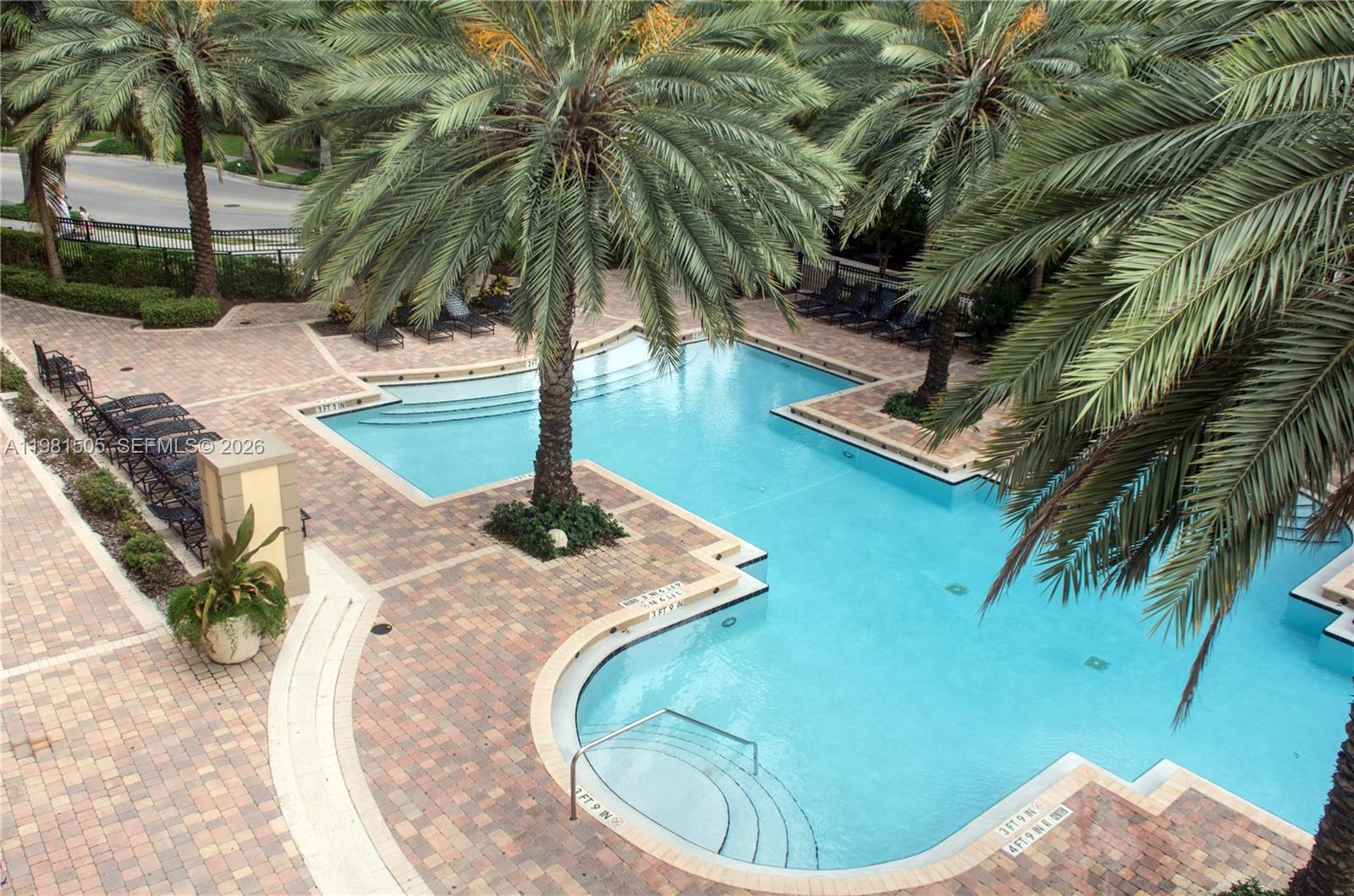 17145 North Bay Road, Unit 4203 Sunny Isles Beach, FL 33160 - Photo 28 of 50 a swimming pool with an outdoor space