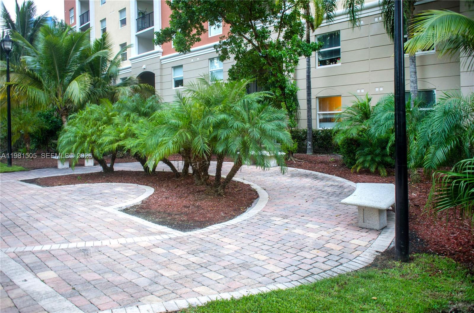 17145 North Bay Road, Unit 4203 Sunny Isles Beach, FL 33160 - Photo 44 of 50 a view of a house with yard and plants