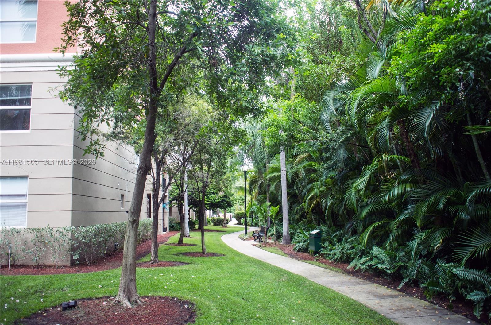 17145 North Bay Road, Unit 4203 Sunny Isles Beach, FL 33160 - Photo 45 of 50 a view of a yard with plants and trees