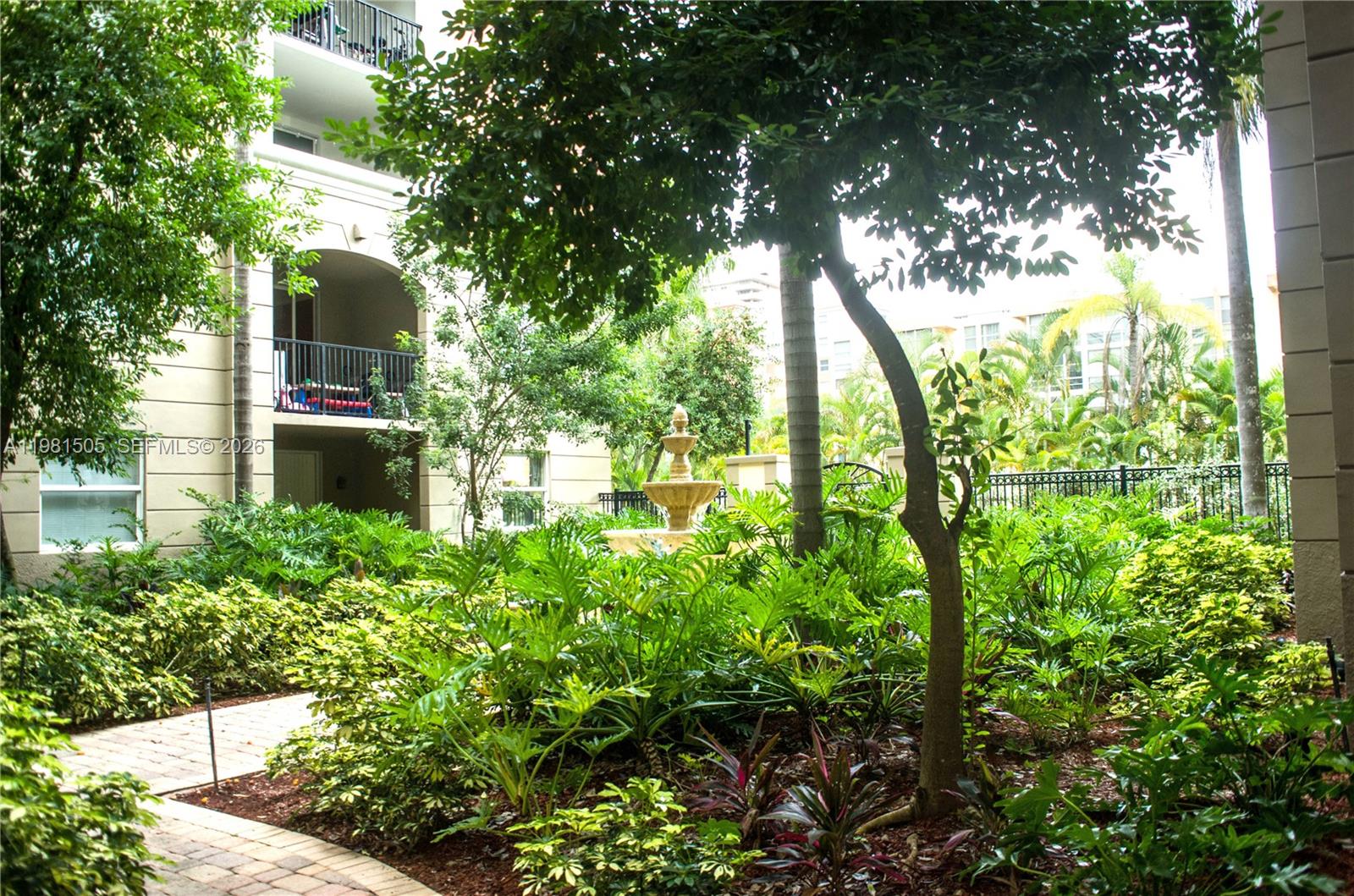 17145 North Bay Road, Unit 4203 Sunny Isles Beach, FL 33160 - Photo 46 of 50 a backyard of a house with lots of green space
