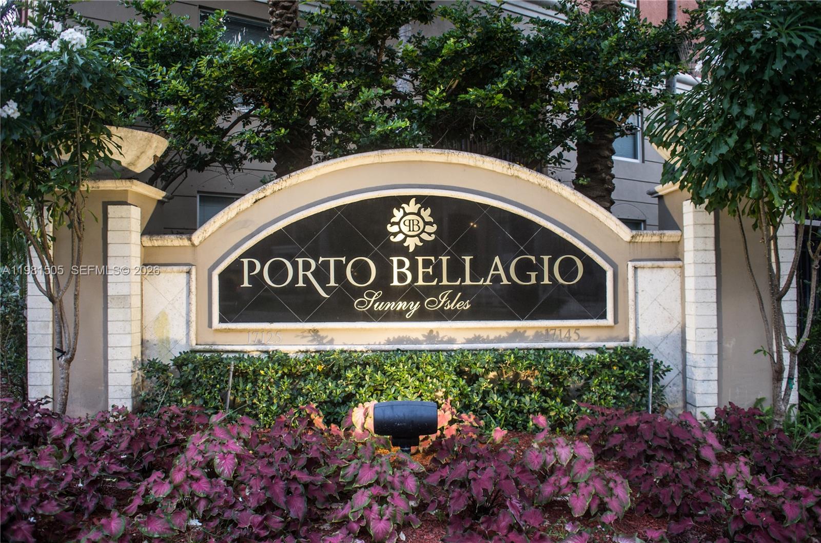 17145 North Bay Road, Unit 4203 Sunny Isles Beach, FL 33160 - Photo 47 of 50 a sign that is sitting in front of flowers