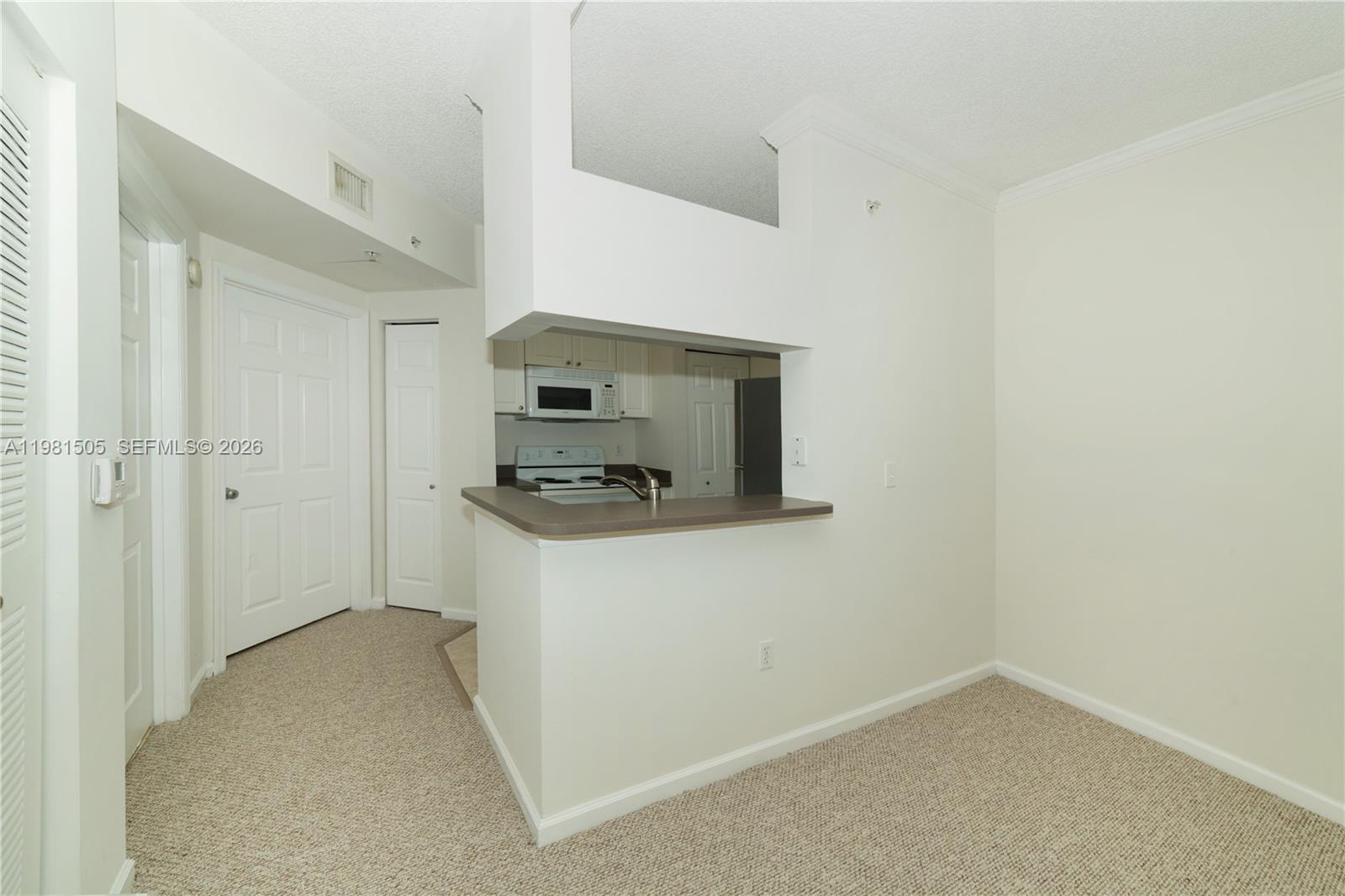 17145 North Bay Road, Unit 4203 Sunny Isles Beach, FL 33160 - Photo 6 of 50 a view of kitchen and microwave