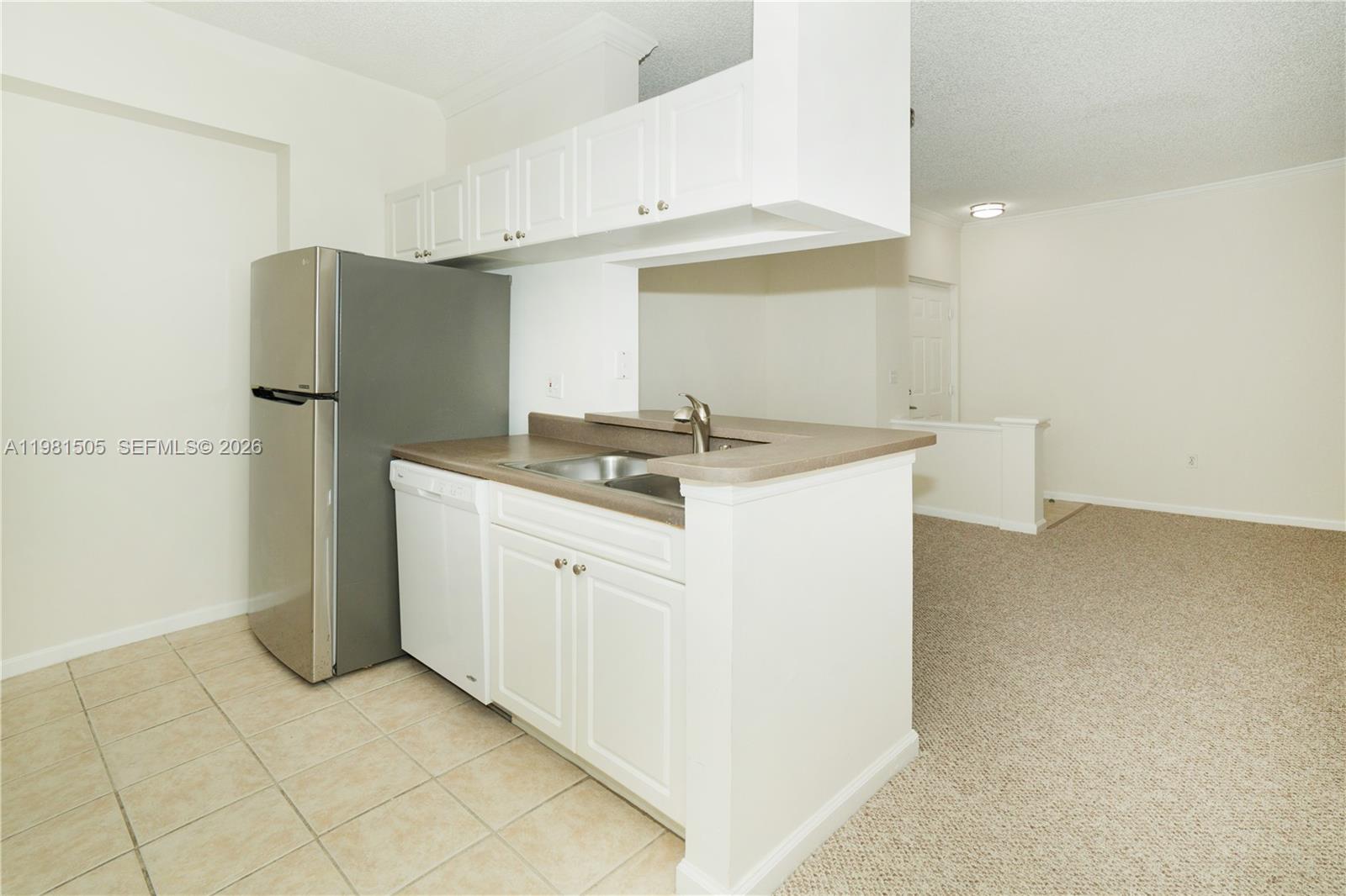 17145 North Bay Road, Unit 4203 Sunny Isles Beach, FL 33160 - Photo 8 of 50 a utility room with cabinets washer and dryer