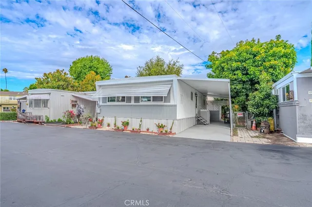 a view of a house with a yard and a garage