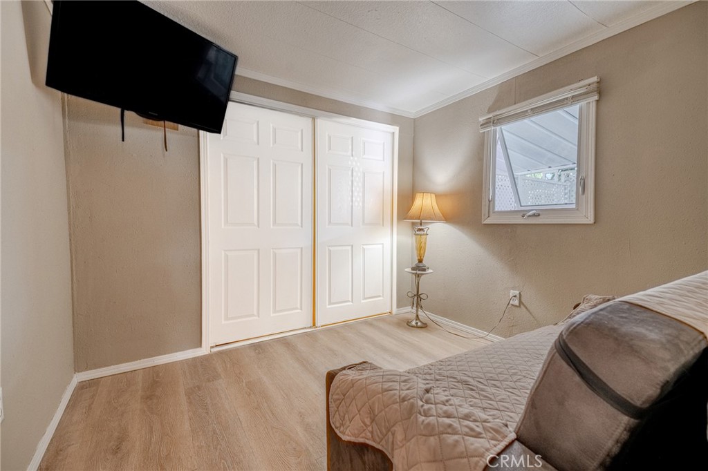 9340 Foothill Boulevard, Unit 68 Rancho Cucamonga, CA 91730 - Photo 11 of 30 a bedroom with a bed and a window