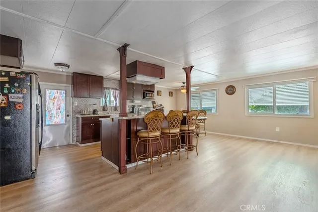 a view of a kitchen and dining room