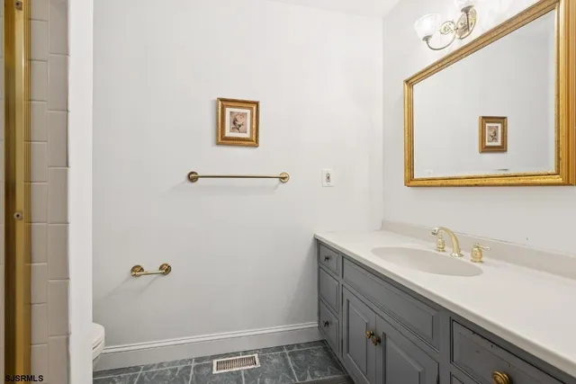 a bathroom with a sink and mirror