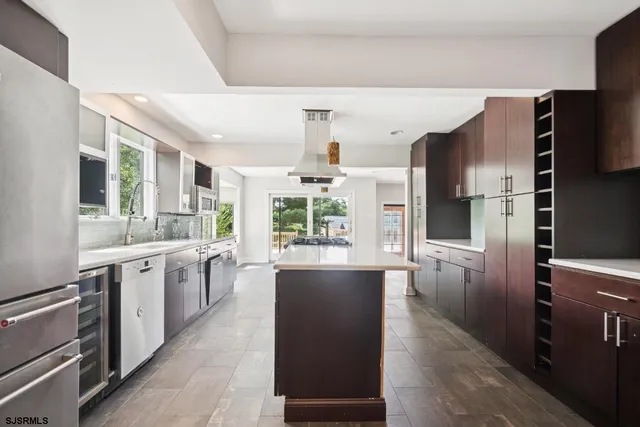 a kitchen with counter top space cabinets and stainless steel appliances