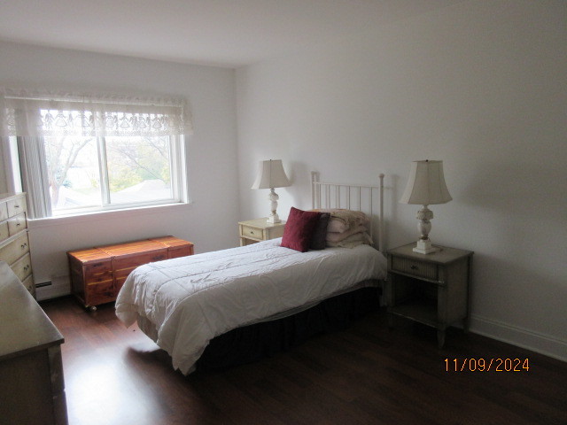 235 North Mill Road, Unit 311B Addison, IL 60101 - Photo 17 of 33 a bedroom with a bed and window