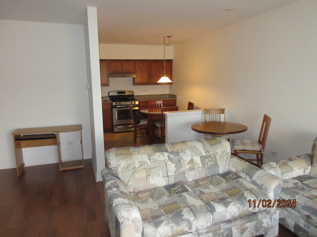 235 North Mill Road, Unit 311B Addison, IL 60101 - Photo 24 of 33 a living room with furniture and a window