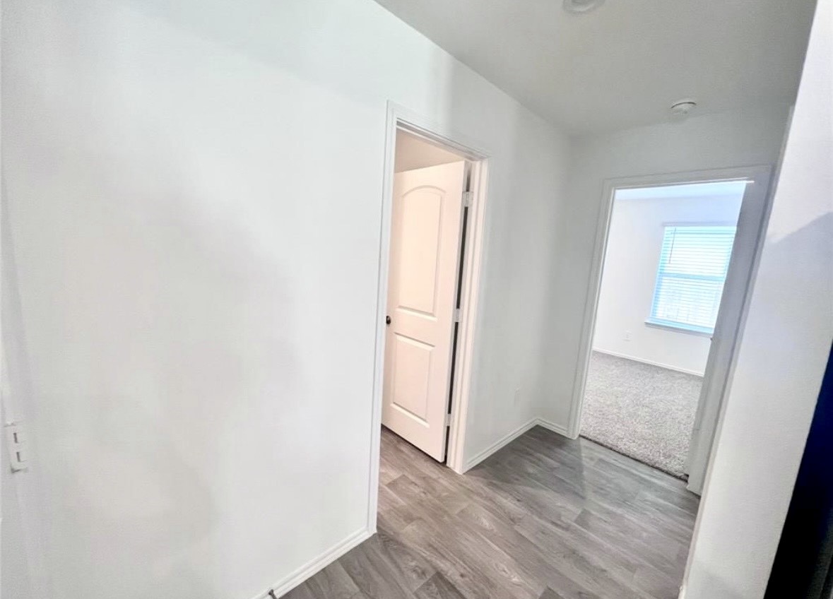 14220 Fern Meadows Drive Splendora, TX 77372 - Photo 12 of 22 a view of empty room with wooden floor