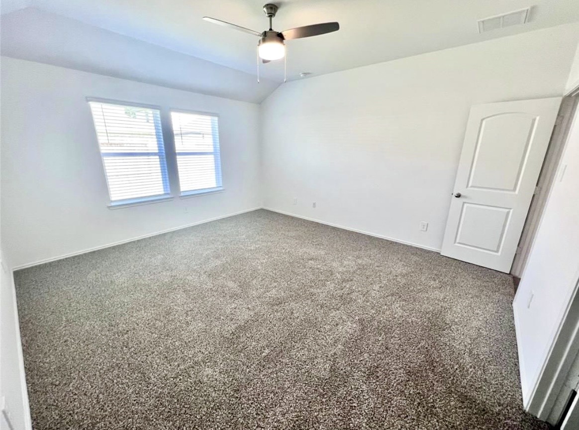 14220 Fern Meadows Drive Splendora, TX 77372 - Photo 13 of 22 en empty room with windows and ceiling fan