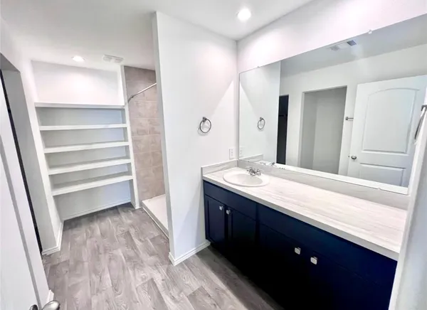 a bathroom with a sink and a mirror
