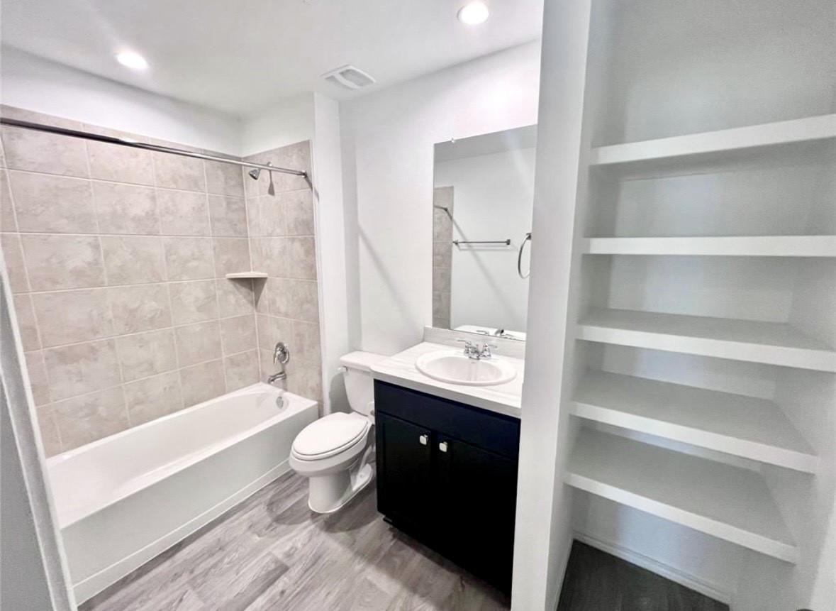 14220 Fern Meadows Drive Splendora, TX 77372 - Photo 18 of 22 a bathroom with a double vanity sink toilet and shower