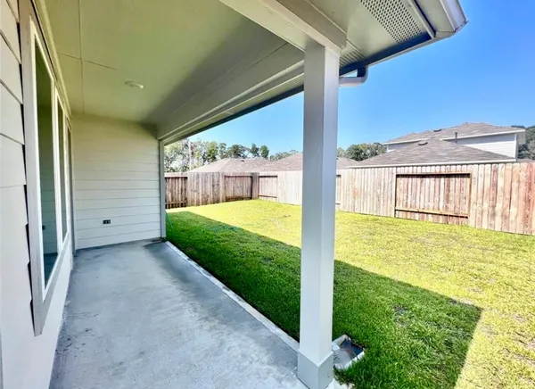 a view of a back yard of a house