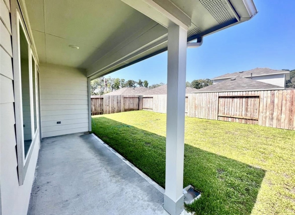 14220 Fern Meadows Drive Splendora, TX 77372 - Photo 21 of 22 a view of a back yard of a house
