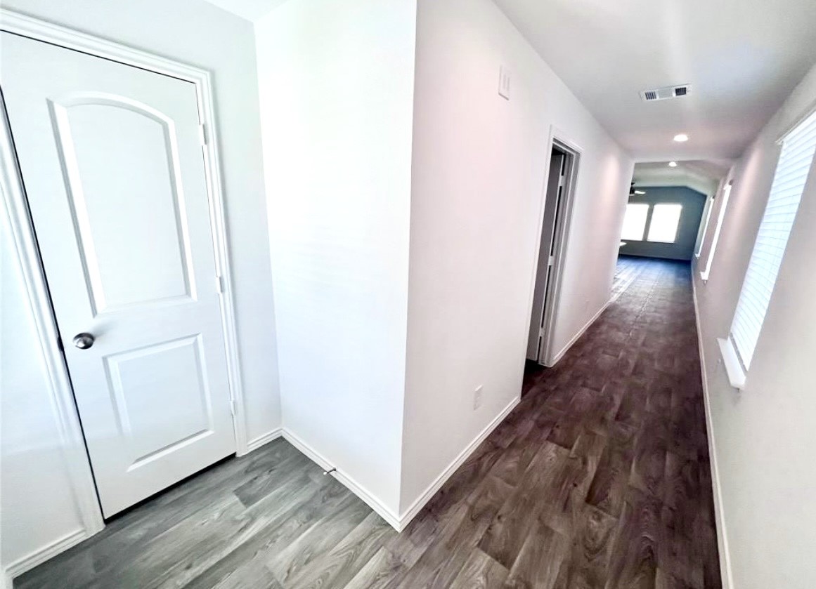 14220 Fern Meadows Drive Splendora, TX 77372 - Photo 3 of 22 a view of a hallway with wooden floor