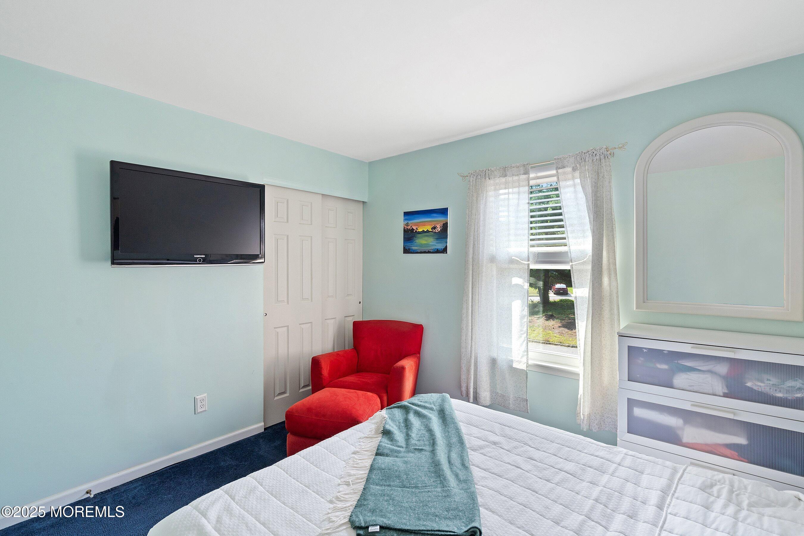 10 Cove Court Howell, NJ 07731 - Photo 24 of 40 a bedroom with a bed and a flat screen tv