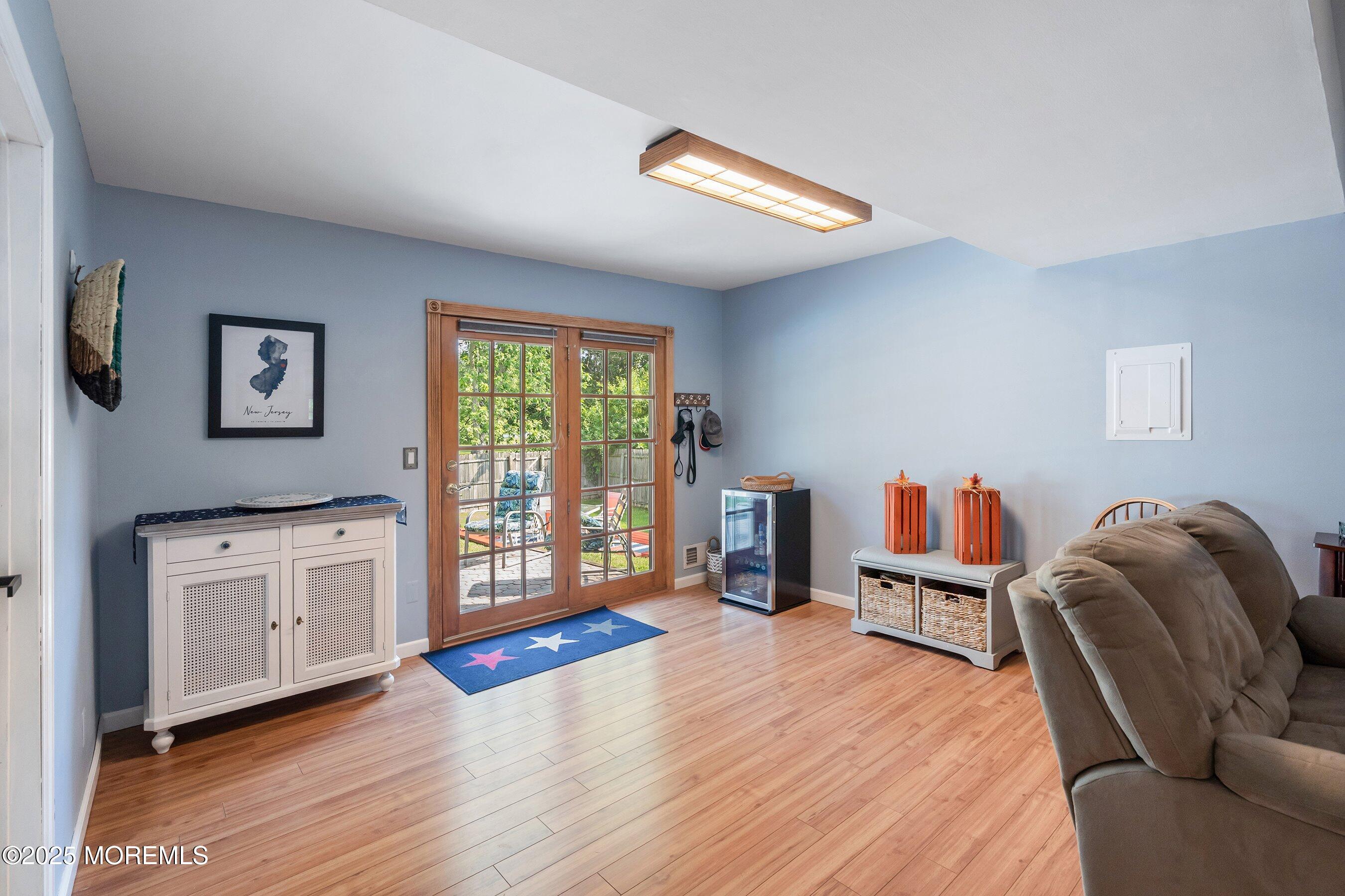10 Cove Court Howell, NJ 07731 - Photo 27 of 40 a living room with furniture and a wooden floor