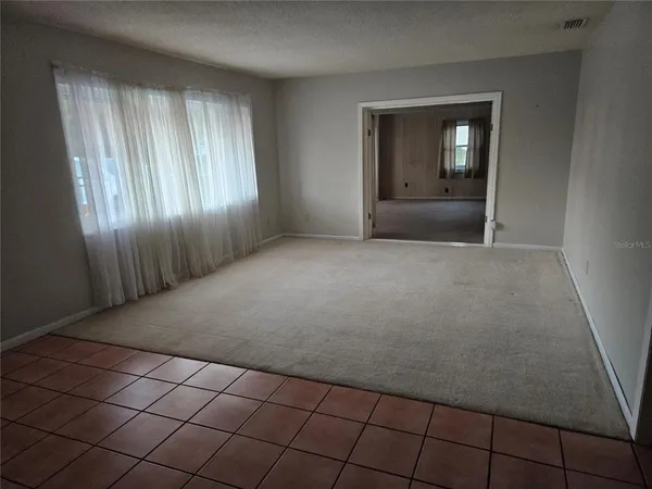 an empty room with entrance door