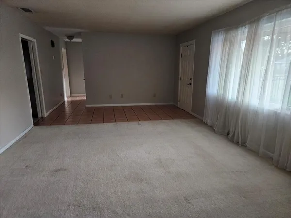 a view of empty room with windows