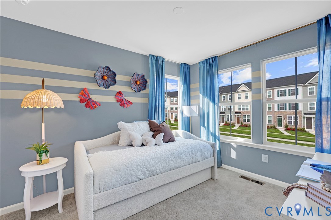 6117 Primrose Path Road Richmond, VA 23225 - Photo 14 of 27 a bedroom with a bed and a window
