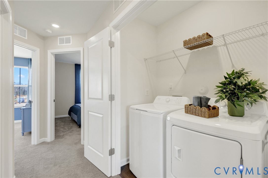 6117 Primrose Path Road Richmond, VA 23225 - Photo 24 of 27 a view of storage and utility room with washer and dryer