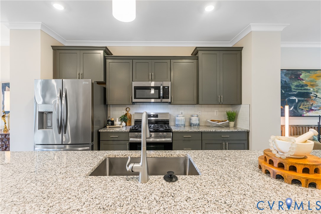 6117 Primrose Path Road Richmond, VA 23225 - Photo 10 of 23 a kitchen with stainless steel appliances granite countertop a refrigerator and a sink