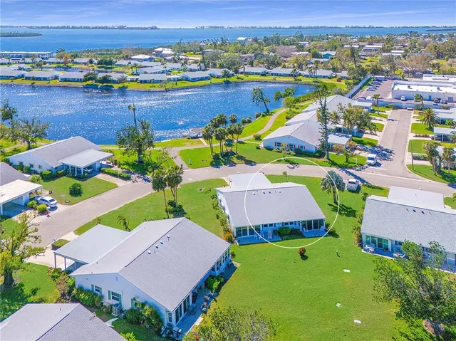 an aerial view of a house with a swimming pool yard and outdoor seating