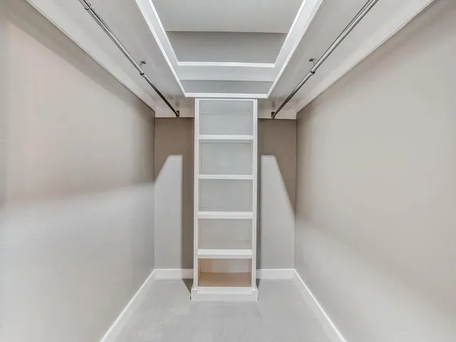 a view of an empty walk in closet