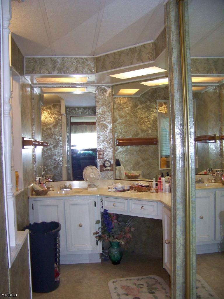 2607 Beaudry Road Yakima, WA 98901 - Photo 16 of 28 a room with stainless steel appliances a sink and cabinets
