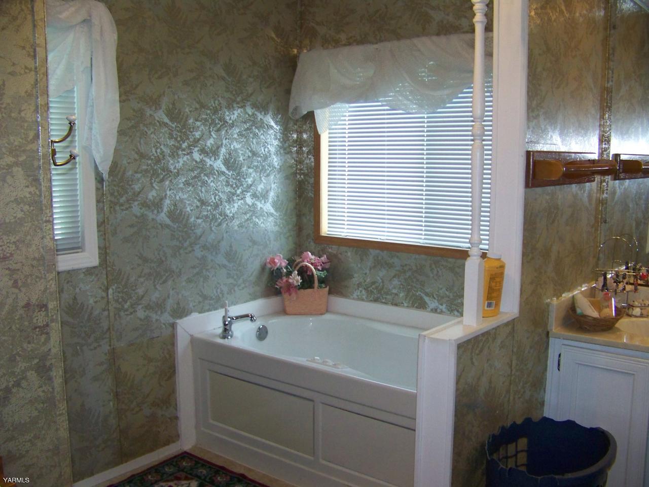 2607 Beaudry Road Yakima, WA 98901 - Photo 17 of 28 a bathroom with a sink and a mirror