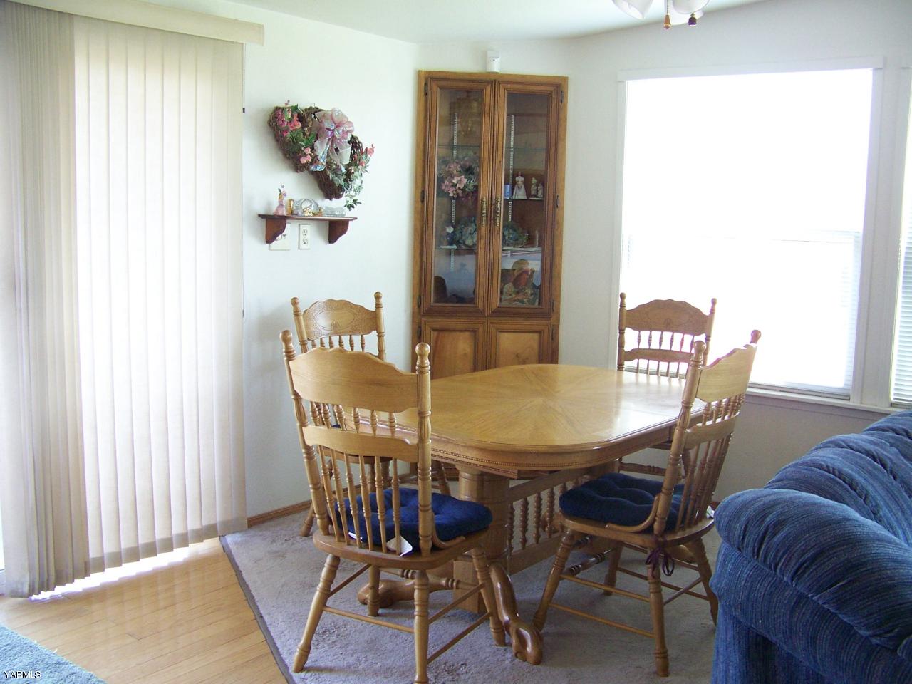 2607 Beaudry Road Yakima, WA 98901 - Photo 23 of 28 a view of a dining room with furniture and wooden floor