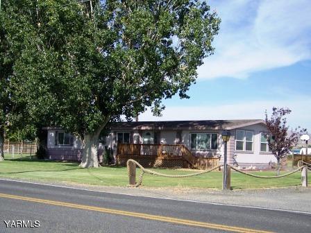 2607 Beaudry Road Yakima, WA 98901 - Photo 28 of 28 a front view of a house with a garden and trees