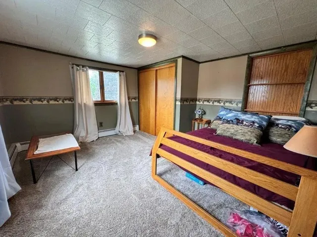 a bed room with a bed and a window