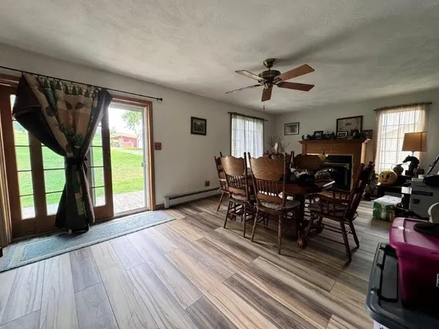 a view of a livingroom with furniture window and wooden floor